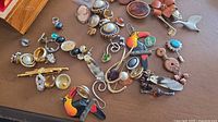assorted costume jewelry pieces laid out on table