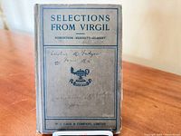 Front cover showing title, editor names, emblem, inscription, overall wear