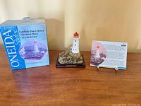 Box, figurine on base, information card