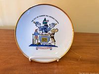 Front view of plate showing crest and gold rim