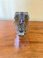 front view of vase showing beveled edges and purple flower cluster