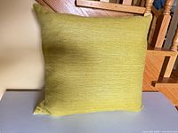 Front view of chartreuse woven pillow