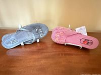 Top view of silver and pink mesh slippers showing uppers and floral design