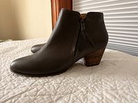 Side profile of both boots showing color, shape, heel