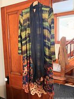 Front view showing multicolour pattern, shawl collar drape and pockets