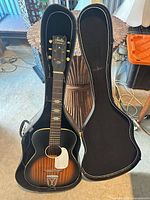 Full view of guitar inside open case