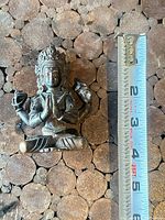 Front view with ruler showing approx 3 in height