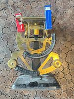 Full view of mechanical balance scale showing tray, frame, sliders, and base