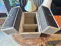 Case open showing twin wing compartments and central padded compartment