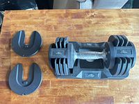 Flybird adjustable dumbbell in cradle with two separate weight plates
