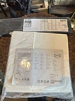 Sealed Ikea Skubb storage box and Komplement shelf packaging with labels visible