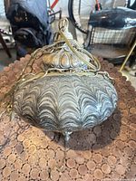 Overall view of smoked glass hanging lamp with brass chain