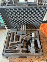 Entire open case showing gimbal and accessories seated in foam