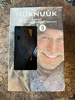 Retail box showing Nuknuuk men’s slippers size 9 with viewing window