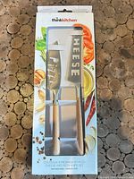 Front of boxed thinkkitchen pizza and cheese knife set