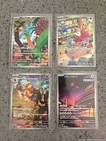 Group shot of four sleeved Japanese Pokémon full-art cards laid out 2×2