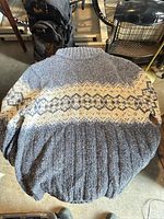 Front view of blue heather sweater with cream Fair Isle band