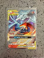 Front of Reshiram & Charizard GX card in sleeve