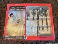 Boxed Sears Quality Stainless 20-piece cutlery set showing spoons and packaging details