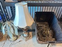 Overall view showing both table lamps and bin of brass lamp parts