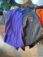 Front view of purple/charcoal colour-block Roots shirt