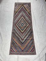 Full view of runner rug on white background