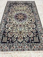 Full overhead view of the Naein rug displaying entire design and condition