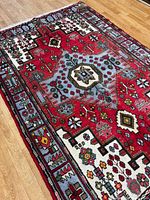 Full view of Nahavand rug on hardwood floor