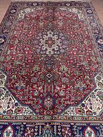 Full view of Tabriz rug showing entire pattern and borders