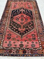 Full view of Zanjan rug showing complete pattern and fringe