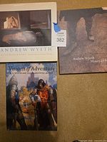 Front covers of the three hardcover books