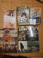 All five books laid out cover visible