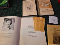 Overview of three Gibran books, open yearbook, two bookmarks and paper slip