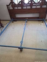 Wood king headboard and metal split frame on wheels
