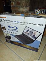 Front of Sylvania SDVD1336 retail box showing product image and features