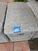 Top view of Suncast storage box showing textured lid and overall condition
