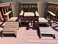 Full set on deck showing two chairs, two footrests, side table