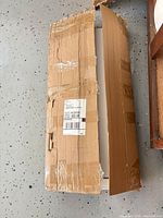 sealed shipping carton containing desk hutch parts