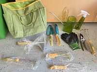 Full set with tote, hand tools, gloves, watering accessories visible