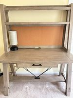 Front view of desk with hutch, corkboard, drawer, lamp