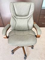 Front view of gray faux leather swivel office chair