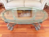 Table front view showing glass top and metal base