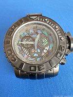 Front view of Invicta Sea Hunter watch showing abalone dial, chronograph sub-dials and bezel markings