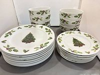 Stacked dinner plates, salad plates and bowls showing Christmas Day pattern