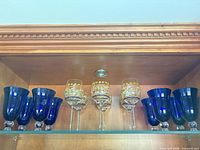 Front view of all 12 glasses on shelf