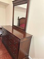 dresser with mounted mirror angled view