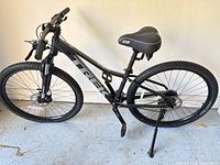 Full side view of Trek Marlin bike showing frame size, wheels, fork, saddle, kickstand, reflectors