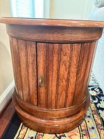Front view of fluted drum end table closed