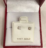 Diamond stud earrings on 14KT GOLD display card in box