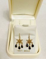 Front view of earrings on display card marked 14KT GOLD